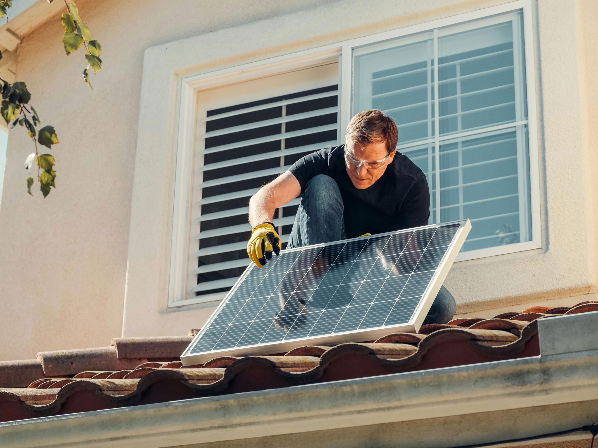 Contractor installing solar panels